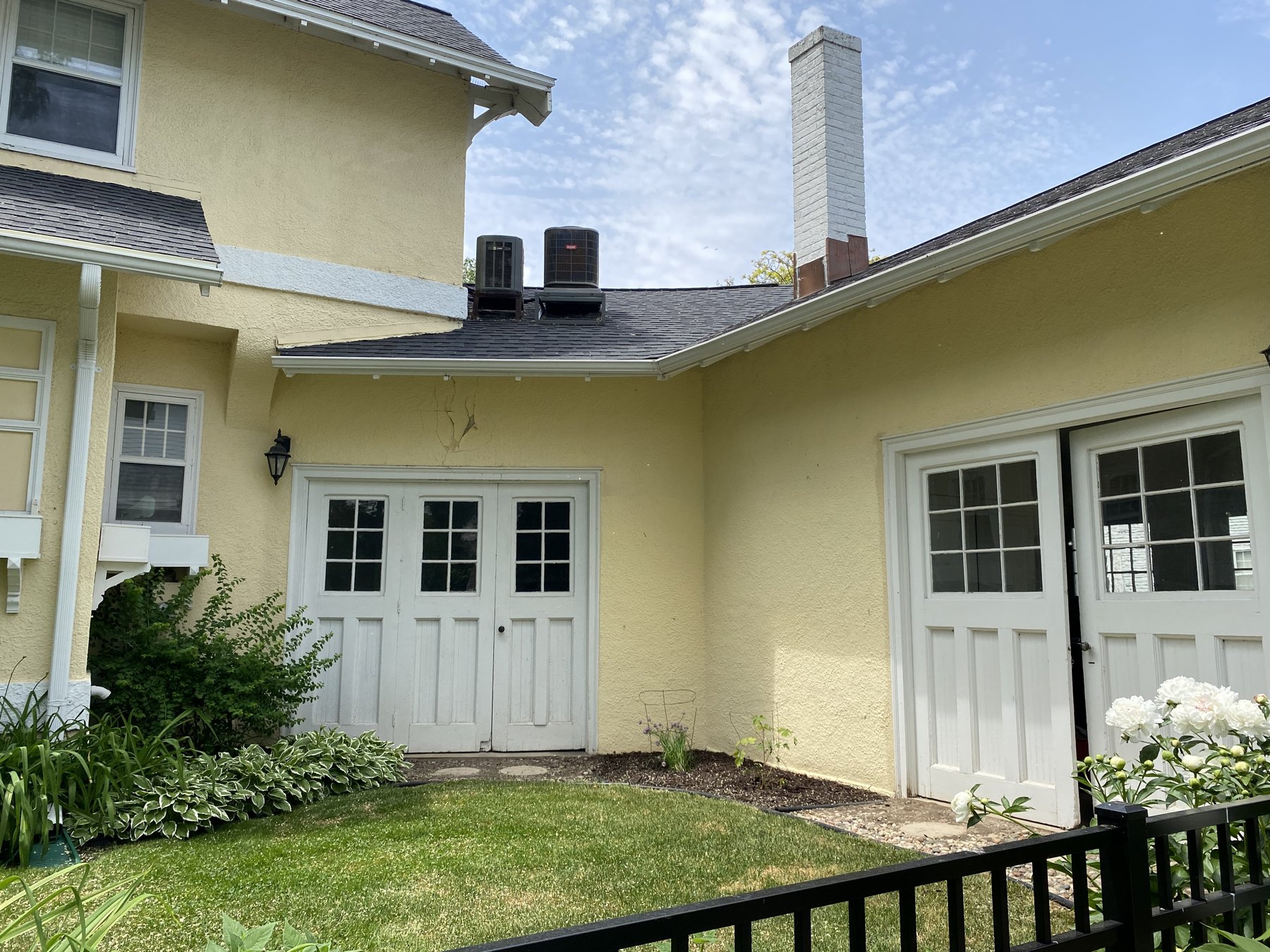 Original glazed and hinged doors on the E. Forest Avenue side
